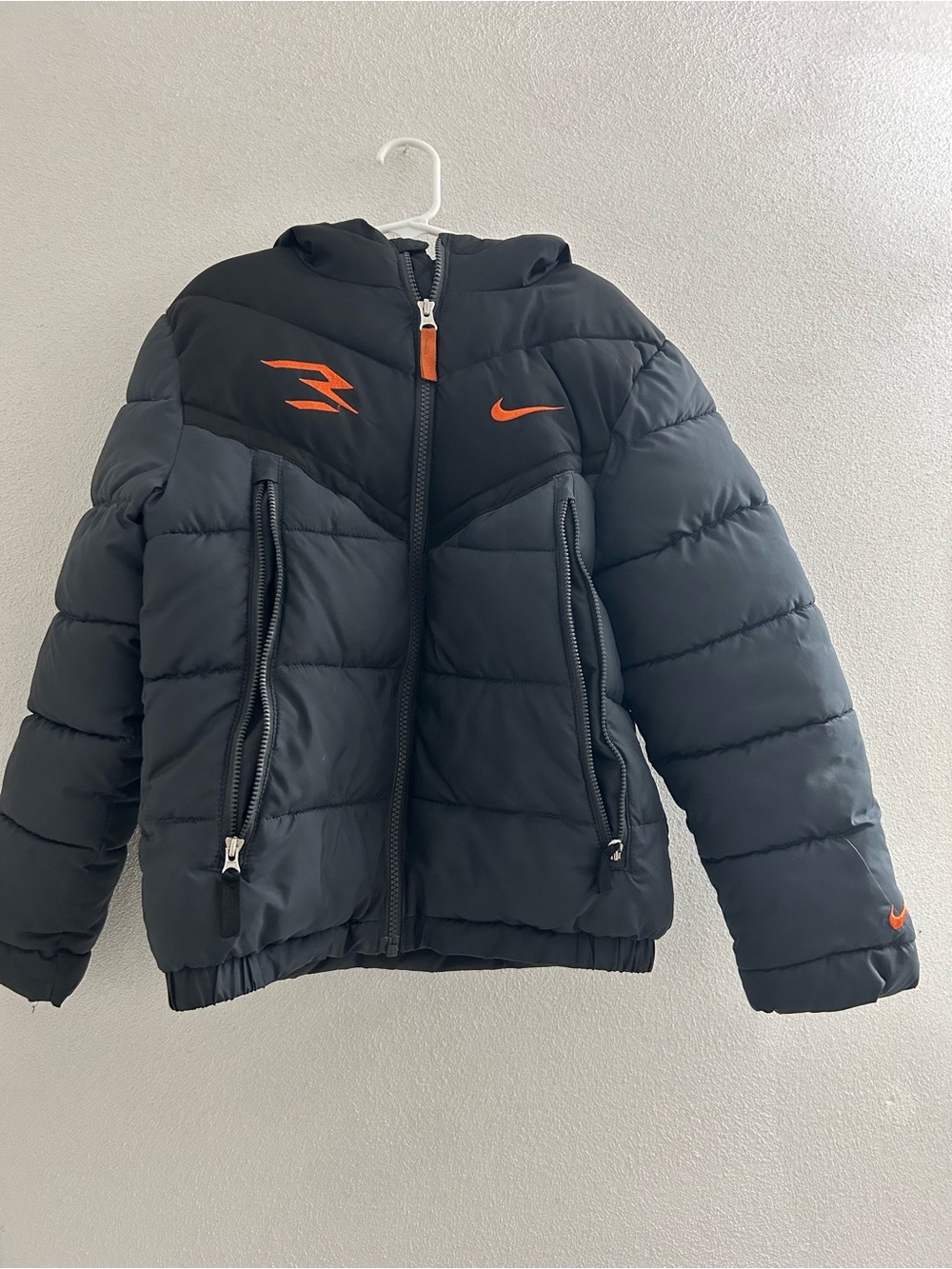 Nike Kids Black Puffer Jacket with Orange Logos